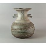 A large studio pottery vase, 20th century, of baluster form with wide rim and lugs to neck,