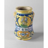 An Italian maiolica albarello, 17th/18th century, painted with a roundel of a man, wearing a long