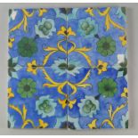 A collection of twenty eight modern tiles, of Persian taste, decorated with abstract floral designs,