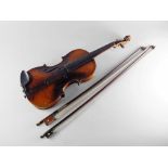 A Continental violin, late 19th/early 20th century, bears label for Antonio Stradivarius, 60cm long,