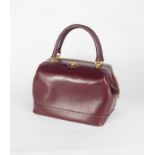 Gucci burgundy leather 'doctors' style weekend travel bag, zip closure, gilt metal hardware and