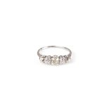 A five stone graduated diamond ring, in unmarked white metal mount,