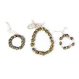 Three strings of Venetian glass trade beads, 19th century, thirty nine beads total,