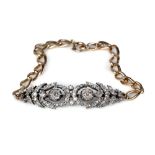 A diamond set bracelet, the central diamond section of openwork design, mounted in white metal,