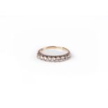 A diamond nine stone half eternity ring,