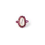 A ruby and moonstone dress ring, claw mounted oval cabochon moonstone,