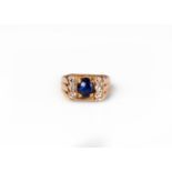 A cabochon sapphire and diamond ring,