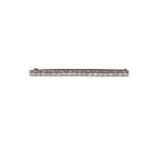 A diamond bar brooch, millegrain set with nineteen graduated brilliant cut diamonds, approx 3.