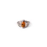 A golden sapphire and diamond ring,