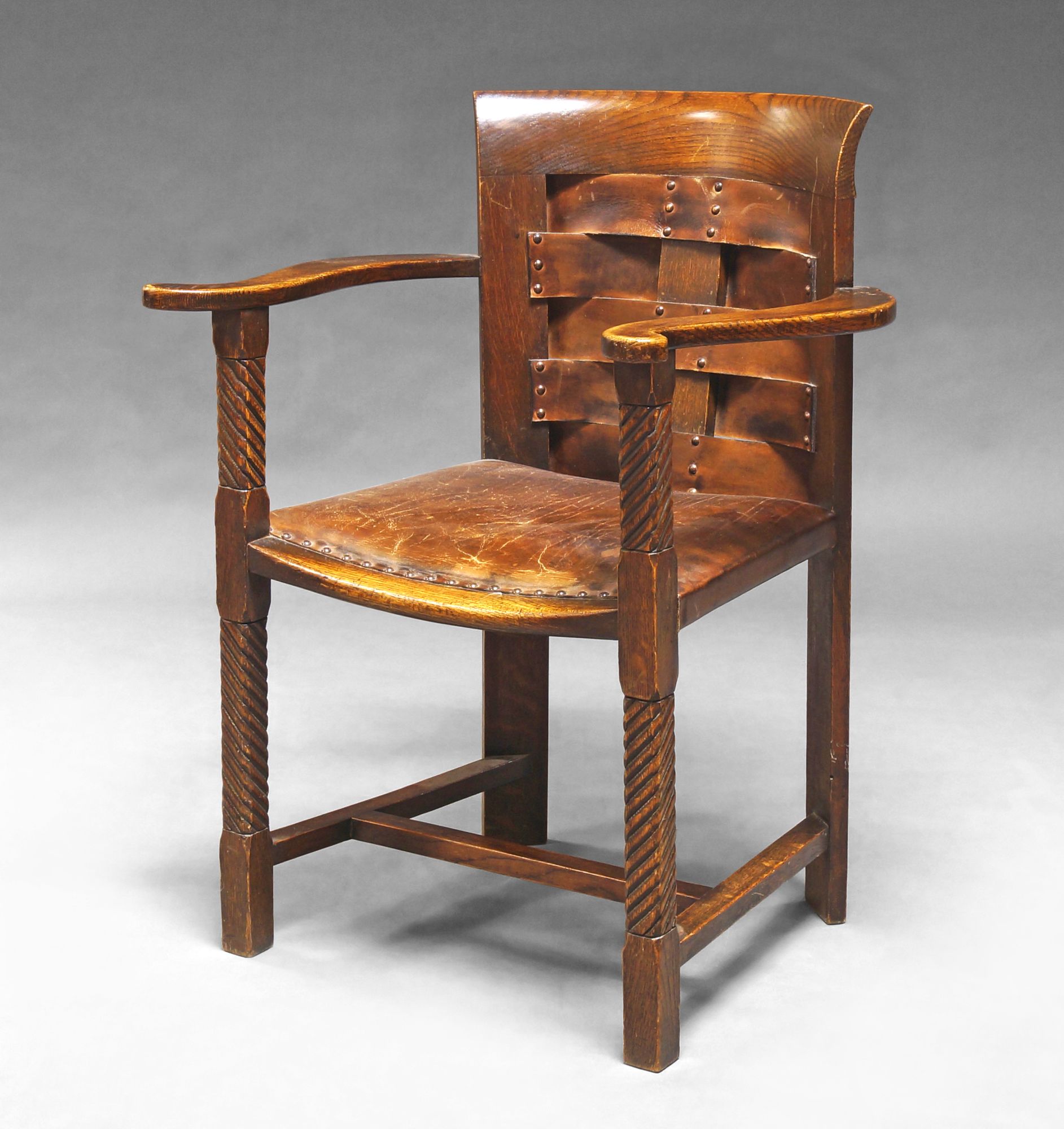 An Arts and Crafts oak armchair, c.