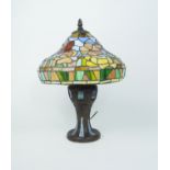 A Tifffany style lampbase, late 20th century, with stained glass shade in the form of flowers, on