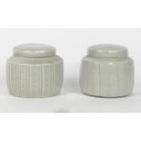 David Leach, British, 1911-2005, a pair of lidded pots with pale celadon glaze, one with incised