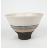 Robin Welch, British, b.1936, a raku studio pottery bowl, 1988, of flared form, matt black foot