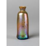 A cylindrical unguentarium glass bottle, possibly late Roman, of balustre form,