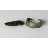 A jet knife handle and a nielloed metal bracelet, Iran, 11th century, the bracelet of open form,