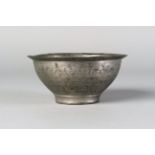 A pewter bowl, Khorasan, 13th century, of deep form, on a short foot with everted rim, 6.