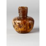 A small amber coloured glass bottle, Central Asia, 12th-13th century,