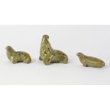 A 20th century green soapstone Inuit figure of a walrus with marine ivory tusks, height 8cm,