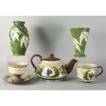 Torquay pottery, a large pottery tea pot and cover, decorated with flowers and foliage,