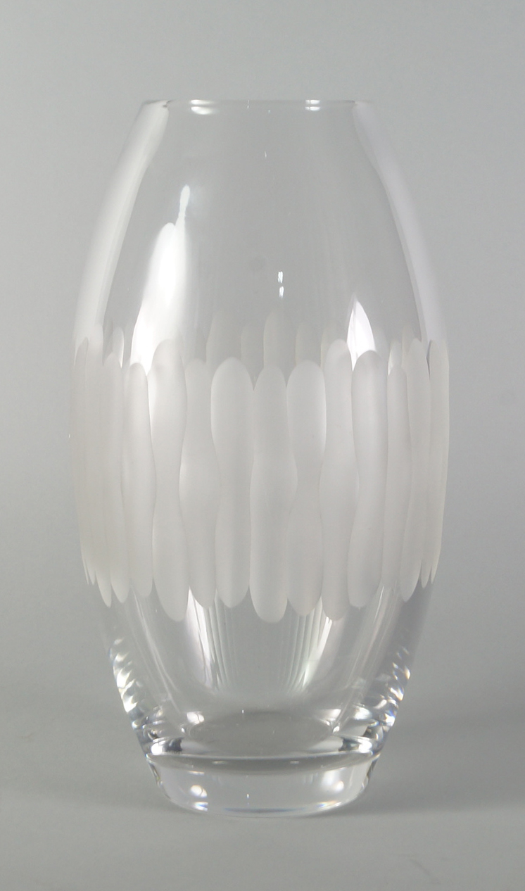 Daum, a clear glass vase , 20th century, of ovoid form decorated with vertical cutting,