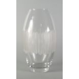 Daum, a clear glass vase , 20th century, of ovoid form decorated with vertical cutting,