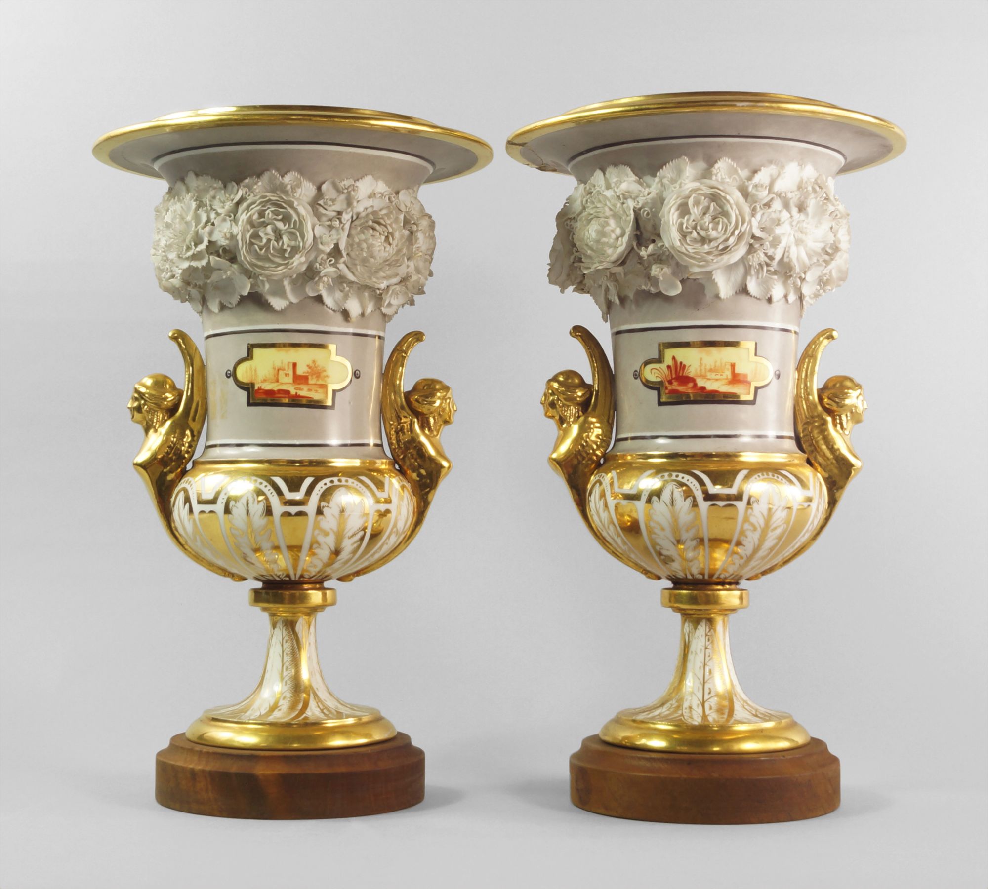 A pair of German porcelain gilt and flower encrusted floral campana urns, early 19th century,