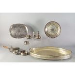 A silver plated galleried tray, cruets and further plated items.