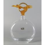 Daum, a glass decanter with a stopper of gilt ring form moulded with an orange pate-de verre snake,