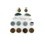 A collection of jade buttons, various sizes, the largest approx 5cm long,