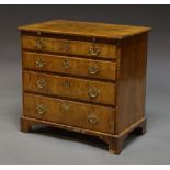 A George I and later walnut bachelor's chest, four long drawers under a brush slide,