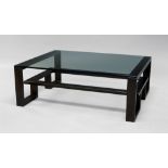 Louise Bradley, a rectangular glass and black anodised coffee table,