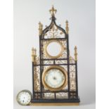 A Gothic taste ebonised and gilt wrought iron clock case, late 19th/early 20th century,
