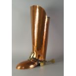 A copper and brass umbrella stand, 20th century, in the form of a postilion's boot,