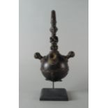 A tribal nut and carved wood pipe, late 19th/20th century,