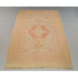 A Soumak rug with deep red medallion in a fawn coloured field with multiple border, 232cm x 159cm,