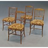 A set of four Victorian mahogany spindle back and upholstered side chairs,