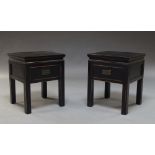 A pair of Chinese taste black lacquer bedside tables, of modern manufacture, 56cm high x 45.