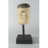 A Tribal carving of head, Central Africa, late 19th/20th century, mounted on a stand,