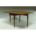 A George III oak provincial dining table, with two hinged flaps, on square legs,