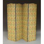 A modem four fold screen, decorated with floral sprays on a cream yellow ground,