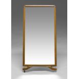 A rectangular mirror, 20th century, with easel form support,