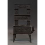 A German cast iron stove, mid 19th century, of graduated block sections,