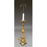 An Italian gilt wood ecclesiastical candlestick, 19th century, on lions paw feet,