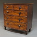 A mahogany bow front chest, 19th century, with two short and three long drawers, on turned feet,