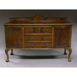 A George V mahogany sideboard, with shaped superstructure back board,