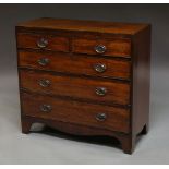 A George III mahogany chest of two short above three long drawers on bracket feet,