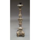 An Italian silvered candlestick, late 17th/early 18th century, converted to a lamp, 77.