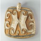 A Double sided carving, possibly Azmac, New Guinea, of rounded paddle form with head form finial,