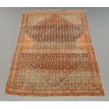 A Shiraz rug in an Indigo field, ivory main border, 206cm x 142cm,