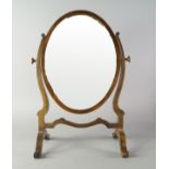 A mahogany and line strung oval dressing table mirror, in the Georgian taste,